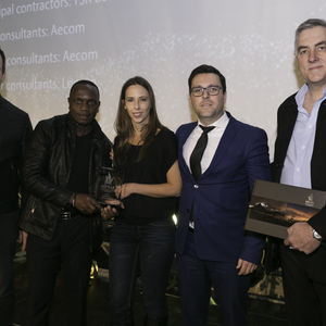 Claire D'Adorante and Thulani Sibande accept the Award for Innovative Developments